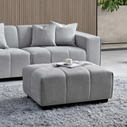 grey corner sofa and a stool