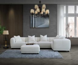 white corner sofa with footstool in the centre